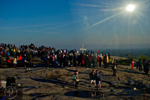 People crowd around the cross at top of Stone Mountain after the 70th annual Easter Sunrise Service on Sunday, April 20, 2014. 