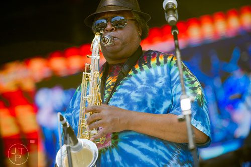 Tenor saxophonist Kevin Harris performs with other members of the Dirty Dozen Brass Band on stage during the Sweetwater 420 Festival at Centennial Olympic Park on Sunday, April 20, 2014. 