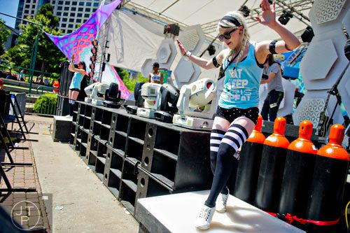Kristin Iris (right) dances as R.L. Shine performs on stage during the Sweetwater 420 Festival at Centennial Olympic Park on Sunday, April 20, 2014. 