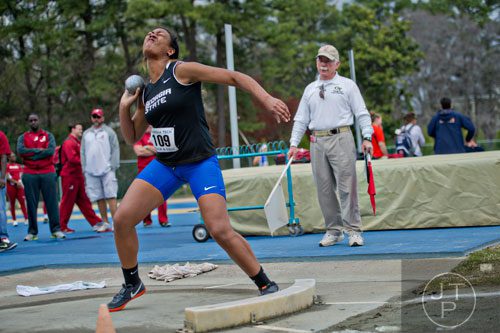 Georgia State's Alysiah Whittaker heaves the shot put during the Yellow Jacket Invitational track meet on Saturday, March 29, 2014.