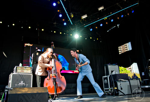 Members of G. Love & Special Sauce, Jim Prescott (left) and Garrett Dutton, perform on stage during the Sweetwater 420 Festival at Centennial Olympic Park on Sunday, April 20, 2014. 