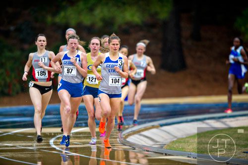 Georgia State's Niamh Kearney (97) and Katharine Showalter (104) round the last curve in the 1500 Meter Run during the Yellow Jacket Invitational track meet on Saturday, March 29, 2014.