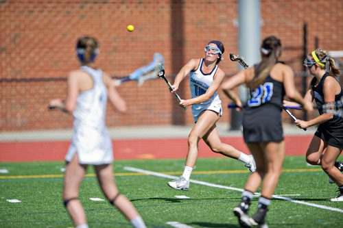 Cambridge's Lily Valeo (18) takes a shot on goal during their game against Lake Norman (NC) on Friday, April 25, 2014.