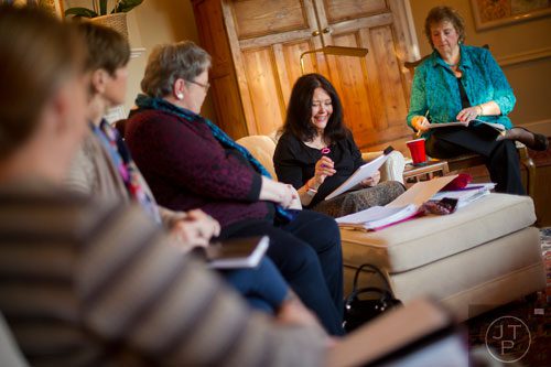 Author Rosemary Daniell (center) leads a Zona Rosa writers' workshop at her sister's home in Buckhead on Thursday, March 20, 2014. 