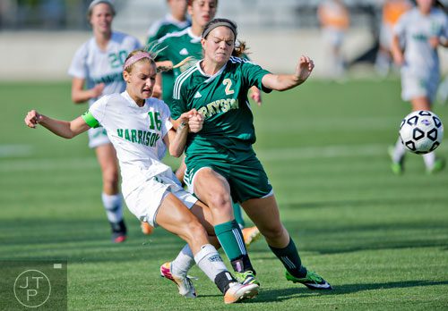 Harrison's Carly Rich (16) ) and Grayson's Allison Pickett (2) collide during the Class AAAAAA championship soccer game at Kennesaw State University on Saturday, May 17, 2014.  