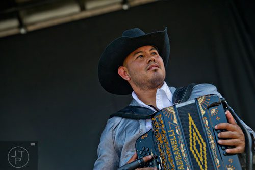 Daniel Munoz plays the accordion as he performs on stage with La Fe de Nuevo Leon during the Cinco de Mayo Festival at Plaza Fiesta in Atlanta on Sunday, May 4, 2014. 