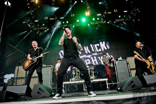 Al Barr (center), Ken Casey (right) and Jeff DaRose from the band Dropkick Murphys perform on stage during the Shaky Knees Music Festival at Atlantic Station in Atlanta on Friday, May 9, 2014. 