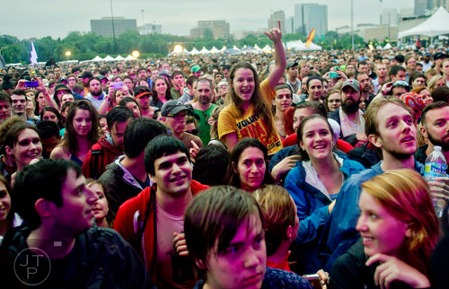 Elizabeth McSherry (center) screams as she watches Spoon perform during the Shaky Knees Music Festival at Atlantic Station in Atlanta on Friday, May 9, 2014.
