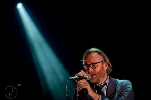 Lead vocalist for The National Matt Berninger croons into the microphone during the Shaky Knees Music Festival at Atlantic Station in Atlanta on Friday, May 9, 2014. 