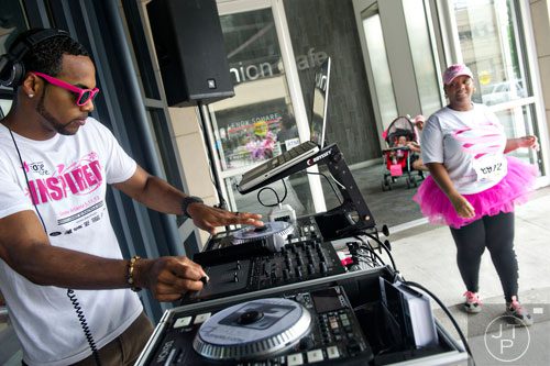 Deejay FadElf spins tunes on turntables after the Susan G. Komen Race for the Cure at Lenox Square Mall on Saturday, May 10, 2014. 