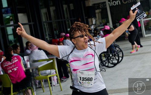 Charmilla Fuller dances after the Susan G. Komen Race for the Cure at Lenox Square Mall on Saturday, May 10, 2014. 