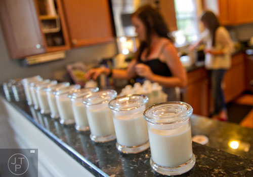 Candles sit ready for labels as Leslie Abrams and Adair Cates make candles for Yo Soy Candles at Cates' home in Midtown, Atlanta on Thursday, May 15, 2014.    