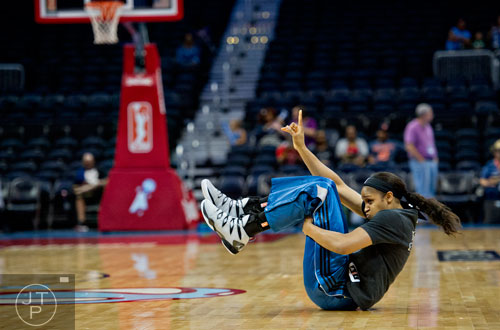 Minnesota Lynx forward Maya Moore pulls a break dance move after warmups before taking on the Atlanta Dream at Philips Arena on Friday, June 13, 2014.   