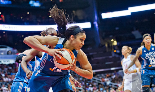 Minnesota's Maya Moore (23) rebounds the ball during their game against the Dream at Philips Arena in Atlanta on Friday, June 13, 2014. 
