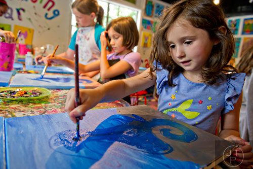 Olivia Longo (right), Whitney Willis and Grace McNabb paint seahorses on pieces of canvas during Beach Week at the Farmhouse in the City in Roswell on Wednesday, June 4, 2014. 