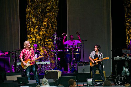 Daryl Hall (left) and John Oates perform on stage at Chastain Park Amphitheatre in Atlanta on Sunday, June 15, 2014. 