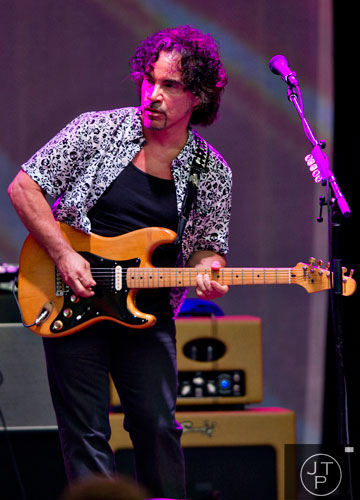 John Oates performs on stage at Chastain Park Amphitheatre in Atlanta on Sunday, June 15, 2014.  