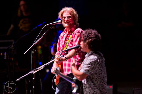 Daryl Hall (left) and John Oates perform on stage at Chastain Park Amphitheatre in Atlanta on Sunday, June 15, 2014.  