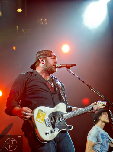 Lee Brice performs on stage at Aaron's Amphitheatre at Lakewood in Atlanta on Friday, July 25, 2014. 