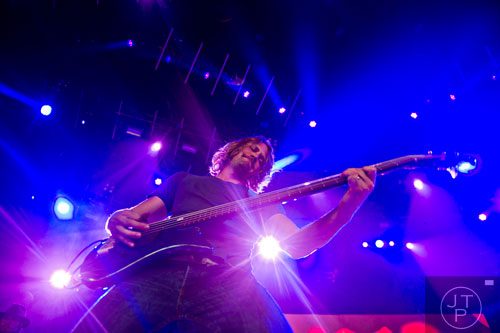 Bassist Paul Rippee performs on stage with Lee Brice during Bryan's That's My Kind of Night Tour at Aaron's Amphitheatre at Lakewood in Atlanta on Friday, July 25, 2014.  