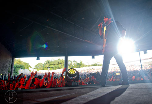 Lee Brice performs on stage at Aaron's Amphitheatre at Lakewood in Atlanta on Friday, July 25, 2014.