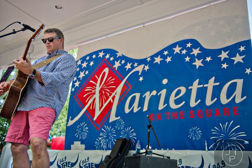 J. Scott Thompson performs on stage in Historic Marietta Square during the city's  Fourth in the Park celebration on Friday, July 4, 2014. 