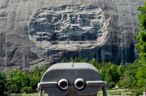 A set of binoculars stare at the face of Stone Mountain on Saturday, July 5, 2014.