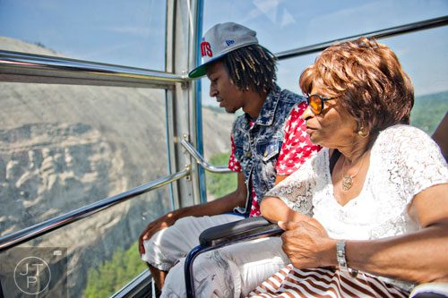 Eloise Williams (right) sits next to her grandson Dantae Moore as they ride the skylift to the top of Stone Mountain during the park's Fantastic Fourth celebration weekend on Saturday, July 5, 2014.  