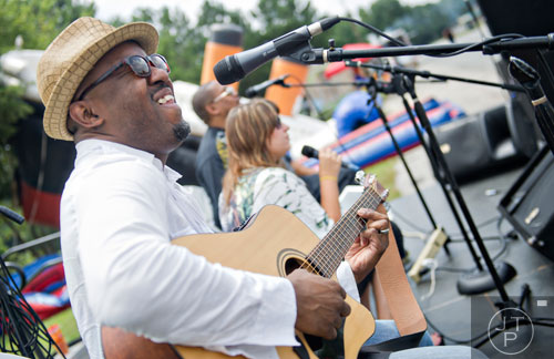 Adrian Blu Moore (left), Lauren Simpson and Chazz Reese perform on stage during the Atlanta Food Festival at Jim R. Miller Park in Marietta on Sunday, July 6, 2014. 