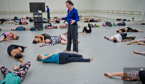 Sarah Hillmer (center) encourages her campers to move in different ways during a contemporary dance class for summer camp at the Atlanta Ballet's Michael C. Carlos Dance Centre in Atlanta on Tuesday, July 8, 2014.   
