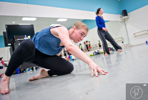 Gracie Flowers (left) moves across the floor as instructor Sarah Hillmer teaches during a contemporary dance class for summer camp at the Atlanta Ballet's Michael C. Carlos Dance Centre in Atlanta on Tuesday, July 8, 2014.  