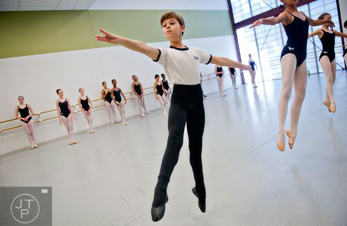 Joshua Nunamaker (left) moves across the floor during a ballet class for summer camp at the Atlanta Ballet's Michael C. Carlos Dance Centre in Atlanta on Tuesday, July 8, 2014.  