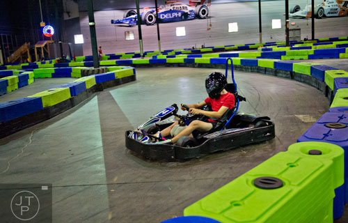 Noah Hambleton drifts through a corner during the Pro Cup Karting summer camp in Roswell on Wednesday, July 9, 2014. 