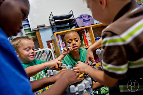 Branden Yeargin (center) plays with other campers during Mad Scientist Week at the Special Needs Schools of Gwinnett Summer Enrichment Camp in Lawrenceville on Wednesday, June 18, 2014. 