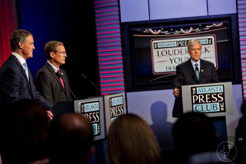 U.S. Senate Republican candidates David Perdue (left) and Jack Kingston answer questions from panelists as Dennis O'Hayer moderates during the Atlanta Press Club's Loudermilk-Young Debate Series at the Georgia Public Broadcasting studios in Atlanta on Sunday, July, 13, 2014.  