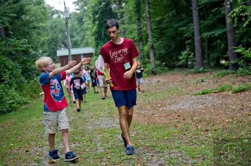 Steade Sullivan (left) and Carter Percy hike a trail down to Sam's Creek during summer camp at Autrey Mill Nature Preserve in Johns Creek on Monday, July 14, 2014. 