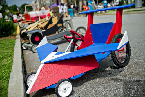 Vehicles line the street before the start of the 2nd annual Cool Dads Rock Soap Box Derby at Historic Fourth Ward Park in Atlanta on Saturday, August 2, 2014. 
