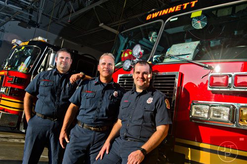 Kevin Keough (center) and his two sons Jordan (left) and Chad (right) are all firefighters for the Gwinnett County Fire Department. 