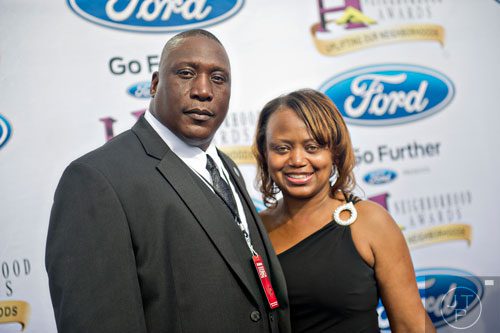 Nominee for Best High School Coach Maurice Freeman (left) poses for photos on the blue carpet before the 2014 Ford Neighborhood Awards at Philips Arena in Atlanta on Saturday, August 9, 2014.