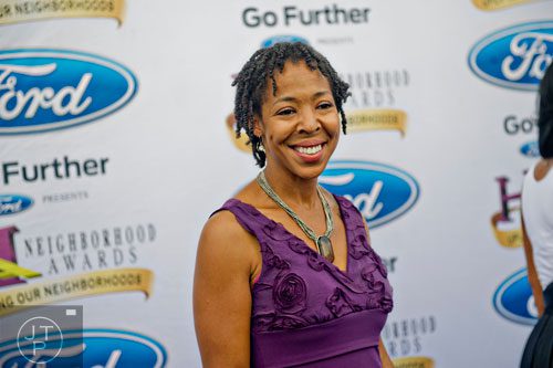 Nominee for Best School Teacher Dr. Antoinette Ellison poses for photos on the blue carpet before the 2014 Ford Neighborhood Awards at Philips Arena in Atlanta on Saturday, August 9, 2014.