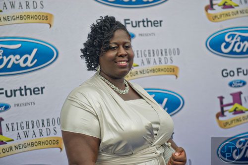 Nominee for Best School Teacher Latoya Jenkins poses for photos on the blue carpet before the 2014 Ford Neighborhood Awards at Philips Arena in Atlanta on Saturday, August 9, 2014. 
