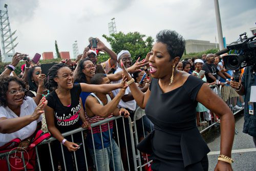Carla Ferrell (right) greets fans before the 2014 Ford Neighborhood Awards at Philips Arena in Atlanta on Saturday, August 9, 2014.