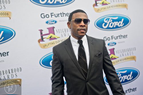 Recording artist Keith Sweat poses for photos on the blue carpet before the 2014 Ford Neighborhood Awards at Philips Arena in Atlanta on Saturday, August 9, 2014. 