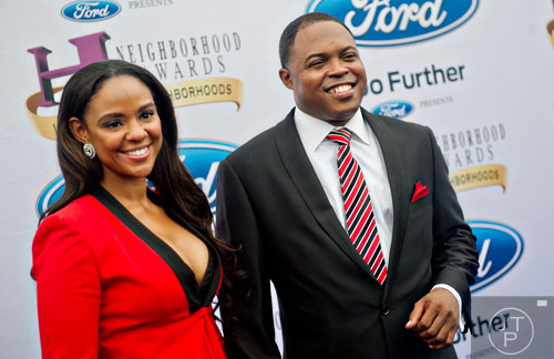 Comedian Kier “Junior” Spates (right) of the Steve Harvey Morning Show poses for photos on the blue carpet before the 2014 Ford Neighborhood Awards at Philips Arena in Atlanta on Saturday, August 9, 2014. 