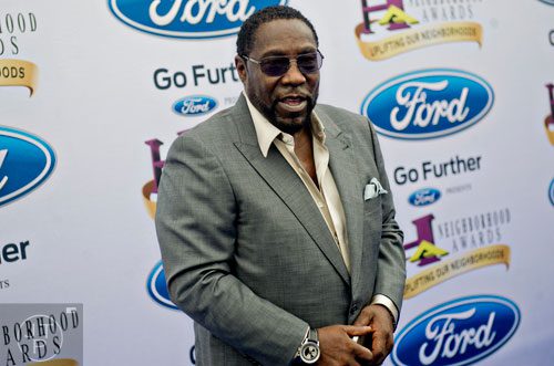 Lead singer of the O'Jays Eddie Levert poses for photos on the blue carpet before the 2014 Ford Neighborhood Awards at Philips Arena in Atlanta on Saturday, August 9, 2014.