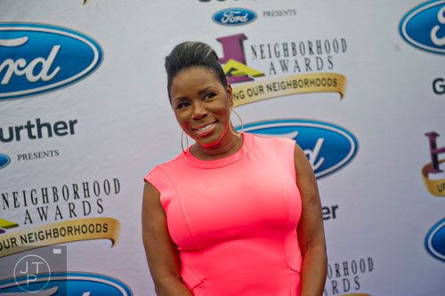 Comedian Sommore poses for photos on the blue carpet before the 2014 Ford Neighborhood Awards at Philips Arena in Atlanta on Saturday, August 9, 2014. 