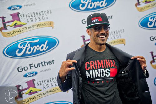 Shemar Moore poses for photos on the blue carpet before the 2014 Ford Neighborhood Awards at Philips Arena in Atlanta on Saturday, August 9, 2014. 