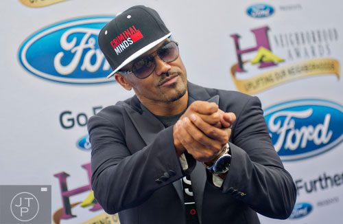 Shemar Moore poses for photos on the blue carpet before the 2014 Ford Neighborhood Awards at Philips Arena in Atlanta on Saturday, August 9, 2014. 