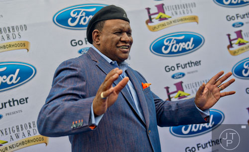 Comedian George Wallace poses for photos on the blue carpet before the 2014 Ford Neighborhood Awards at Philips Arena in Atlanta on Saturday, August 9, 2014. 