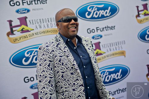 Nathaniel Martin Stroman, better known as the comedian Earthquake, poses for photos on the blue carpet before the 2014 Ford Neighborhood Awards at Philips Arena in Atlanta on Saturday, August 9, 2014. 
